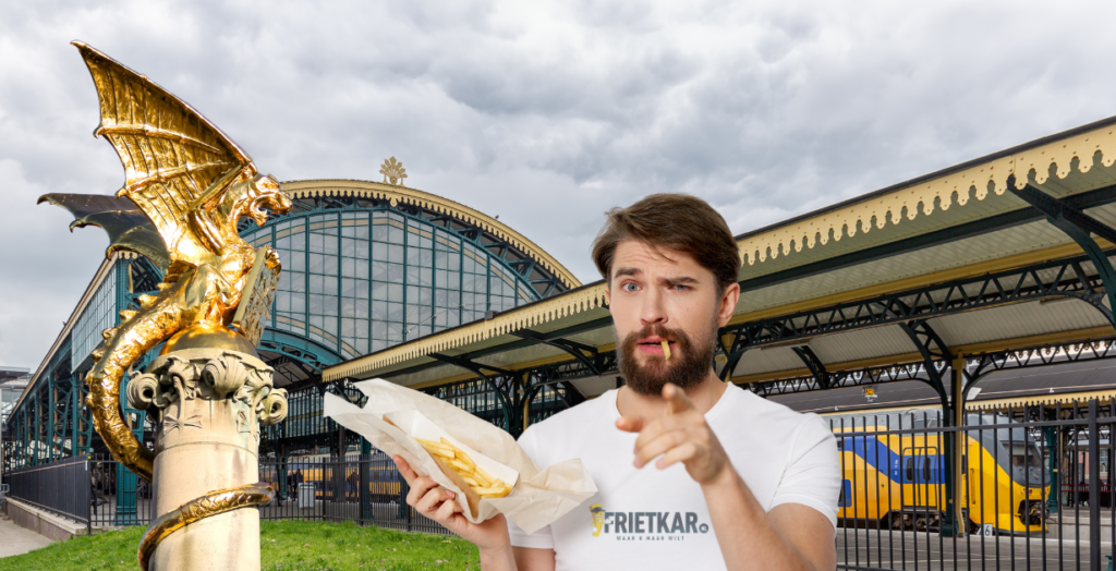 Man wijst met friet van de frietkar voor station Den Bosch en de draak van Den Bosch 